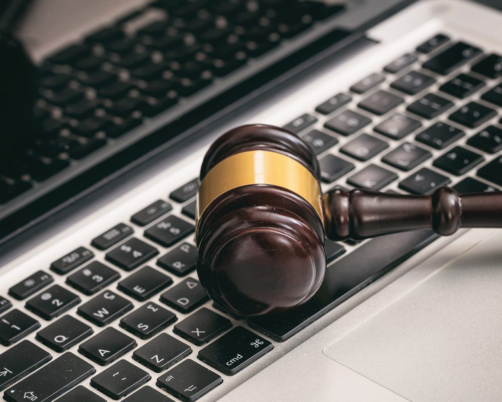 Online auction concept. Auction or judge gavel on a computer keyboard